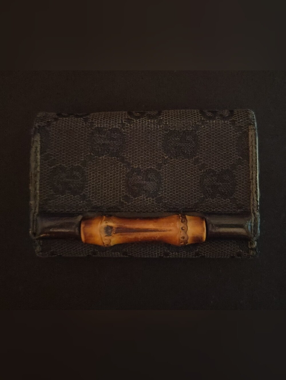 Vintage Gucci GG monogram canvas key holder accent.